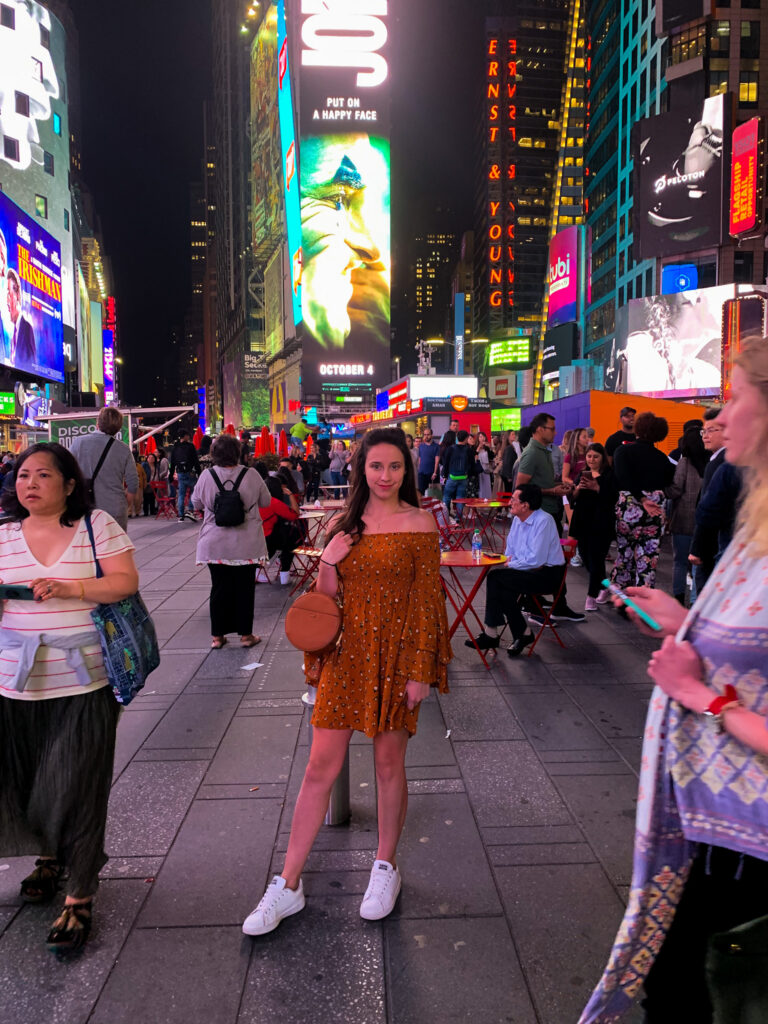 standing girl in times square